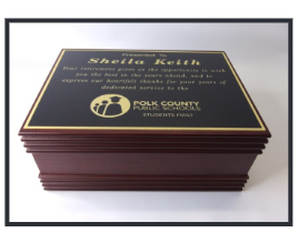 A stack of plaques with the name sheila keith on it.