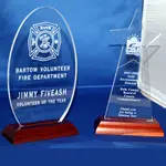 A glass award with the words bartow volunteer fire department and jimmy fiveash, volunteer of the year.